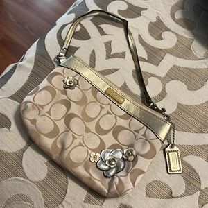 Coach wristlets with flower details